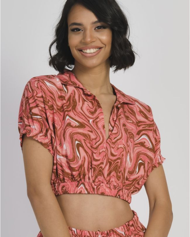 TOP IN RED COLOR WITH PRINTS ONE SIZE